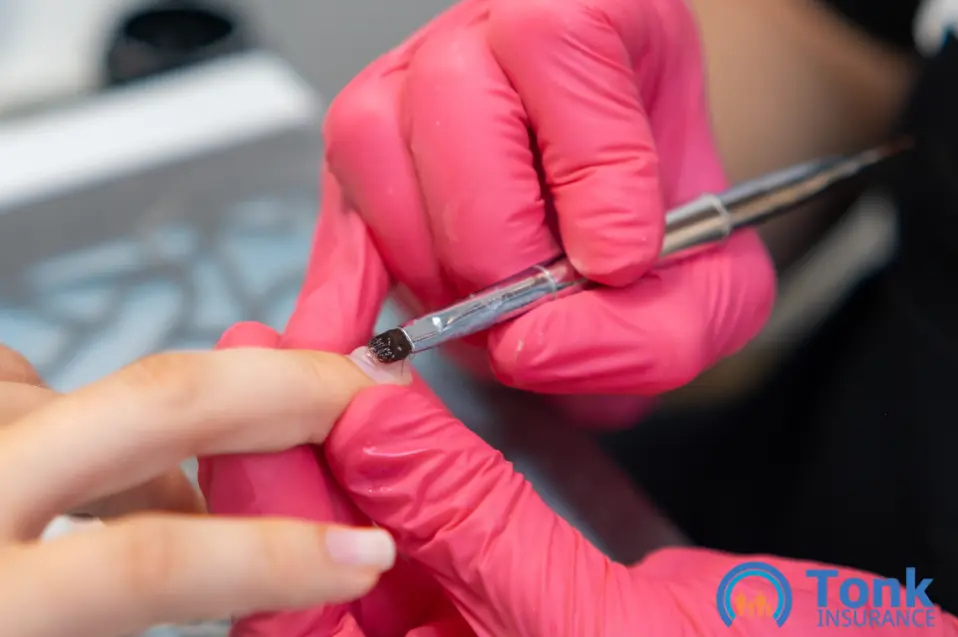 nail technician working on client